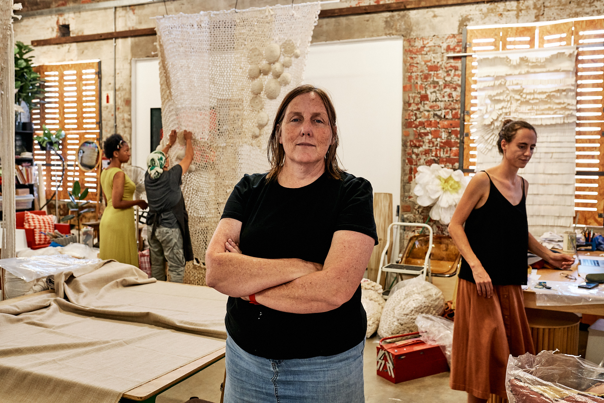 Yellow Thread studio: team at work in the textile workshop.